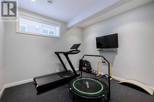 155 Crestridge Hill Sw, Calgary, AB - Indoor Photo Showing Gym Room