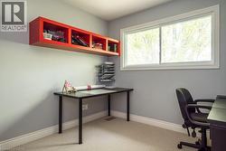 Office featuring light colored carpet and baseboards - 