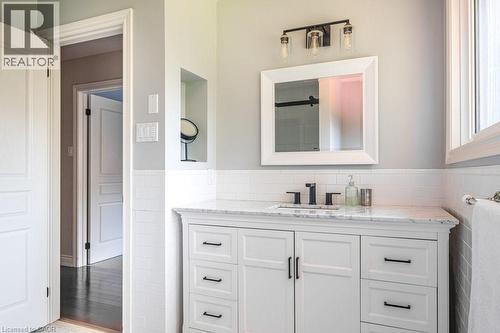 Bathroom with tile walls, vanity, and a wainscoted wall - 330 Strathcona Drive, Burlington, ON - Indoor Photo Showing Bathroom