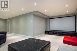 Home theater with carpet, baseboards, and recessed lighting - 
