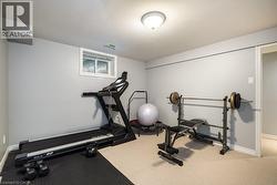 Workout area with baseboards and carpet flooring - 