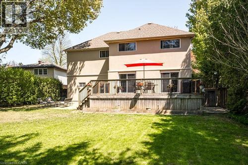 Rear view of property featuring stucco siding, a deck, and a patio - 330 Strathcona Drive, Burlington, ON - Outdoor With Deck Patio Veranda