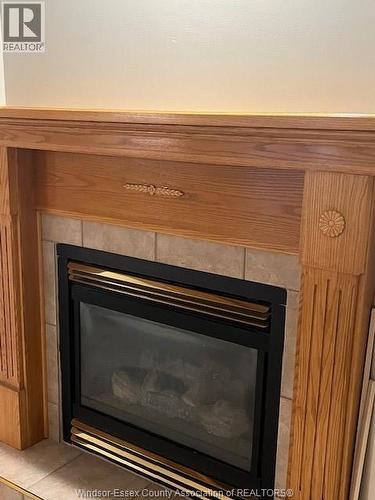 40 Santos, Kingsville, ON - Indoor Photo Showing Living Room With Fireplace