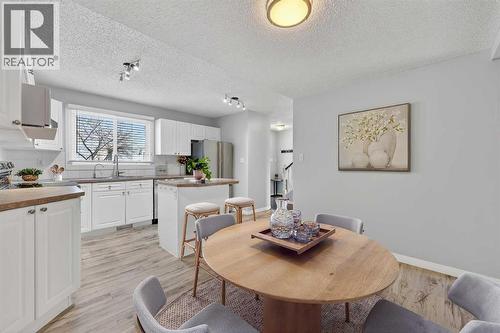 Virtually Staged - 115, 4810 40 Avenue Sw, Calgary, AB - Indoor Photo Showing Dining Room