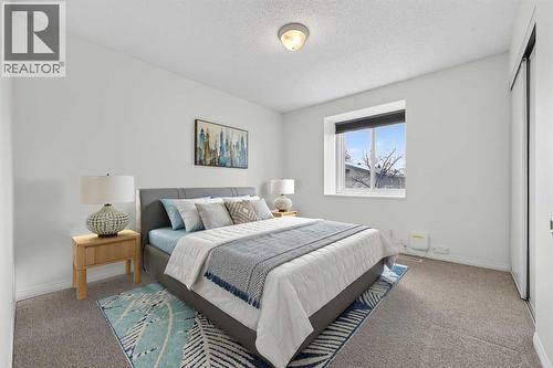 Virtually Staged - 115, 4810 40 Avenue Sw, Calgary, AB - Indoor Photo Showing Bedroom