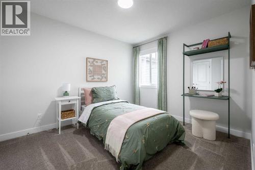 21 Sora Gardens Se, Calgary, AB - Indoor Photo Showing Bedroom