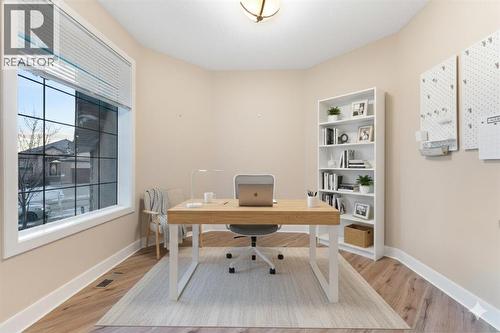 Dedicated office on the main floor (Virtually Staged). - 70 Royal Ridge Manor Nw, Calgary, AB - Indoor Photo Showing Office
