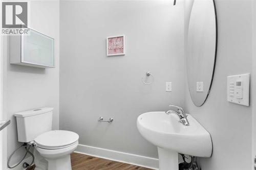 Half-Washroom on the main floor. - 70 Royal Ridge Manor Nw, Calgary, AB - Indoor Photo Showing Bathroom