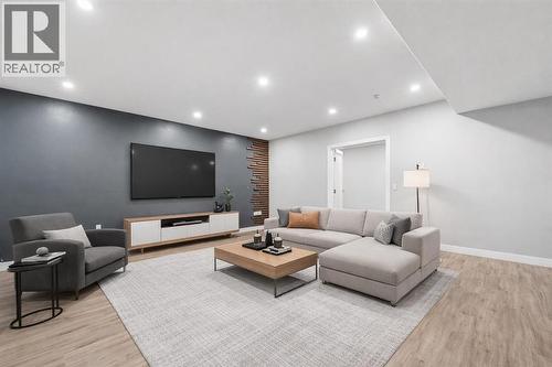 Large, open-concept recreation room in the basement (Virtually Staged). - 70 Royal Ridge Manor Nw, Calgary, AB - Indoor