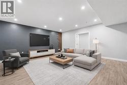 Large, open-concept recreation room in the basement (Virtually Staged). - 