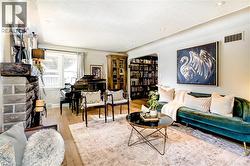 Spacious living room with a cozy wood fireplace - 