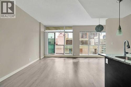 Bright and Spacious Living Room with Floor to Ceiling Windows - 701, 788 12 Avenue Sw, Calgary, AB - Indoor Photo Showing Other Room