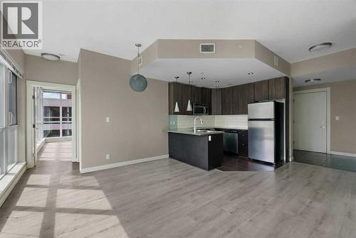 Gourmet Kitchen, Dining Room, and Entrance - 701, 788 12 Avenue Sw, Calgary, AB - Indoor Photo Showing Kitchen With Stainless Steel Kitchen