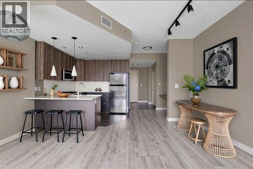 Gourmet Kitchen and Entrance - Virtually Staged - 701, 788 12 Avenue Sw, Calgary, AB - Indoor Photo Showing Kitchen