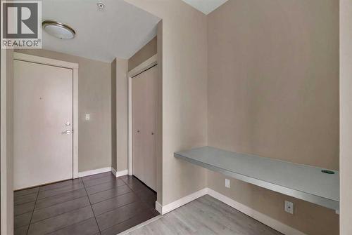 Spacious Entryway and Tech Space - 701, 788 12 Avenue Sw, Calgary, AB - Indoor Photo Showing Other Room