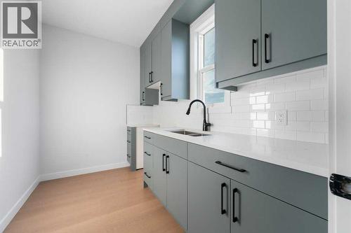 351 Waterford Grove, Chestermere, AB - Indoor Photo Showing Kitchen With Double Sink