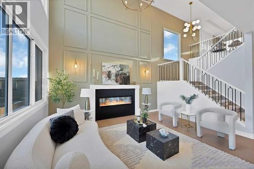 351 Waterford Grove, Chestermere, AB - Indoor Photo Showing Living Room With Fireplace