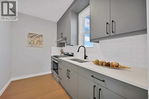 351 Waterford Grove, Chestermere, AB - Indoor Photo Showing Kitchen With Double Sink
