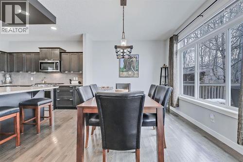 Updated lighting - 9 Copperleaf Way Se, Calgary, AB - Indoor Photo Showing Dining Room