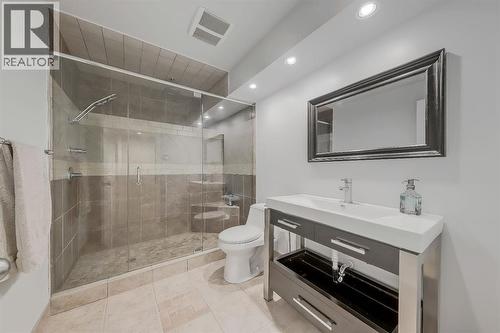 Spa-like basement full bath with tile surround shower - 9 Copperleaf Way Se, Calgary, AB - Indoor Photo Showing Bathroom