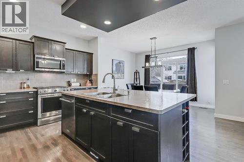 Open and spacious - 9 Copperleaf Way Se, Calgary, AB - Indoor Photo Showing Kitchen With Stainless Steel Kitchen With Double Sink With Upgraded Kitchen
