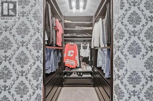 Closet organizers - 9 Copperleaf Way Se, Calgary, AB - Indoor With Storage