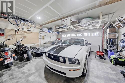 XL Garage! - 9 Copperleaf Way Se, Calgary, AB - Indoor Photo Showing Garage