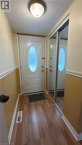 Foyer with wood finished floors and a textured ceiling - 66 Glamis Road Unit# 33, Cambridge, ON - Indoor Photo Showing Other Room