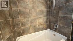 Bathroom featuring bathing tub / shower combination - 