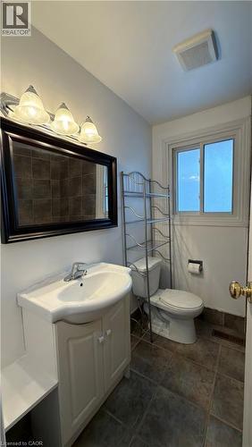 Bathroom featuring vanity and dark tile patterned flooring - 66 Glamis Road Unit# 33, Cambridge, ON - Indoor Photo Showing Bathroom