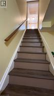 Stairway featuring wood finished floors - 