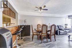 Dining room featuring ceiling fan and a textured ceiling - 