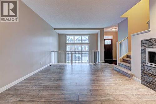 70 Masters Crescent Se, Calgary, AB - Indoor Photo Showing Other Room With Fireplace