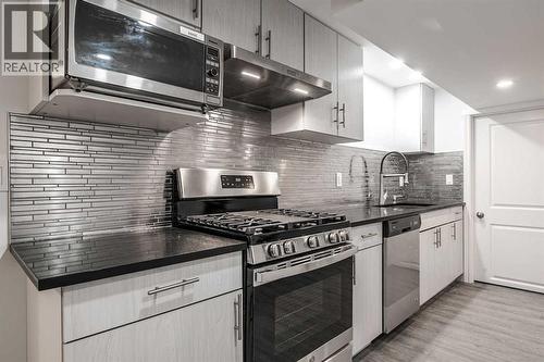 4712 Vegas Road Nw, Calgary, AB - Indoor Photo Showing Kitchen With Upgraded Kitchen