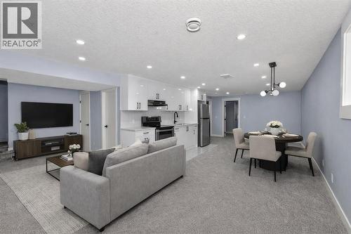 Staged Basement entertainment Room - 432 Ogden Drive Se, Calgary, AB - Indoor Photo Showing Other Room