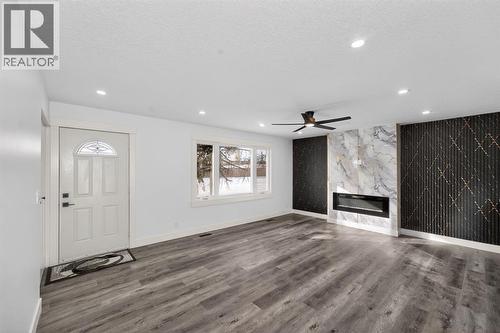 432 Ogden Drive Se, Calgary, AB - Indoor With Fireplace