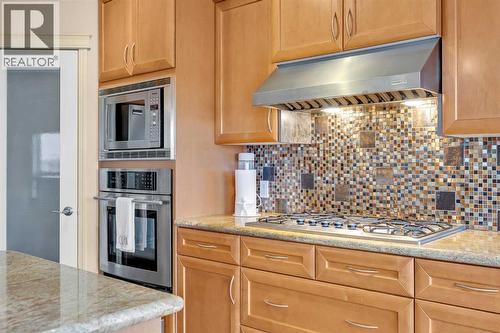 100 Cougarstone Manor Sw, Calgary, AB - Indoor Photo Showing Kitchen