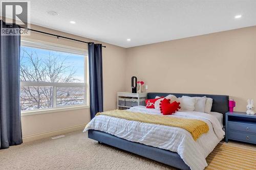 100 Cougarstone Manor Sw, Calgary, AB - Indoor Photo Showing Bedroom