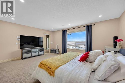 100 Cougarstone Manor Sw, Calgary, AB - Indoor Photo Showing Bedroom