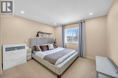 100 Cougarstone Manor Sw, Calgary, AB - Indoor Photo Showing Bedroom