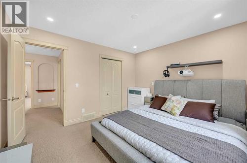 100 Cougarstone Manor Sw, Calgary, AB - Indoor Photo Showing Bedroom
