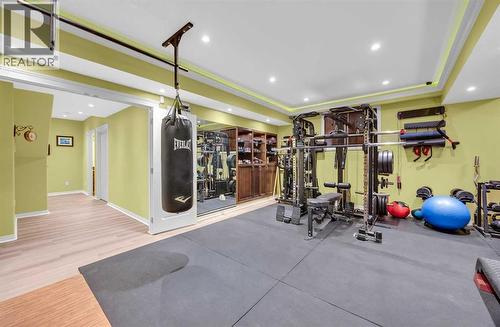 100 Cougarstone Manor Sw, Calgary, AB - Indoor Photo Showing Gym Room