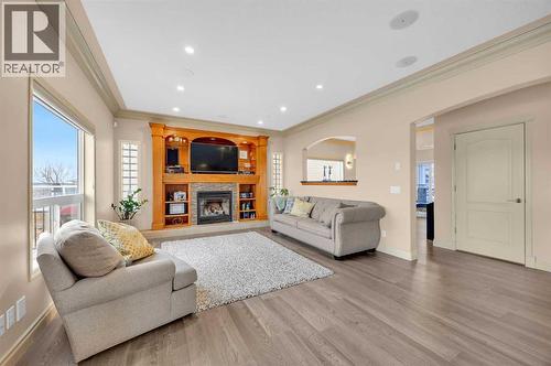 100 Cougarstone Manor Sw, Calgary, AB - Indoor Photo Showing Living Room With Fireplace