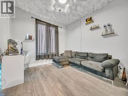 Living area featuring wood finished floors - 