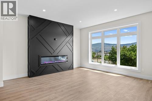1025 Kitson Court, West Kelowna, BC - Indoor Photo Showing Living Room With Fireplace