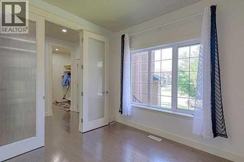 16 Rockcliff Point Nw, Calgary, AB - Indoor Photo Showing Other Room