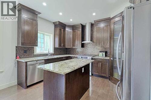 16 Rockcliff Point Nw, Calgary, AB - Indoor Photo Showing Kitchen With Upgraded Kitchen
