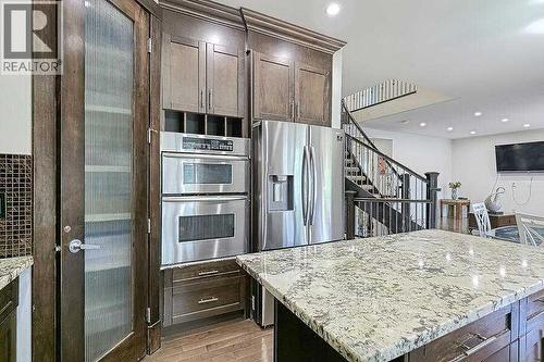 16 Rockcliff Point Nw, Calgary, AB - Indoor Photo Showing Kitchen With Upgraded Kitchen
