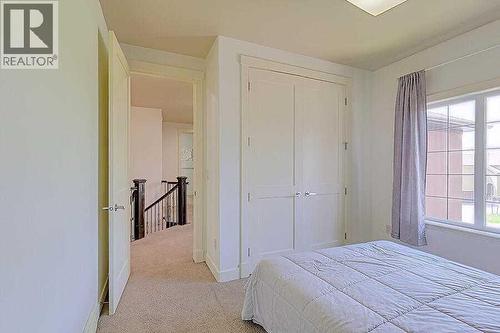 16 Rockcliff Point Nw, Calgary, AB - Indoor Photo Showing Bedroom