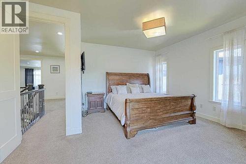 16 Rockcliff Point Nw, Calgary, AB - Indoor Photo Showing Bedroom